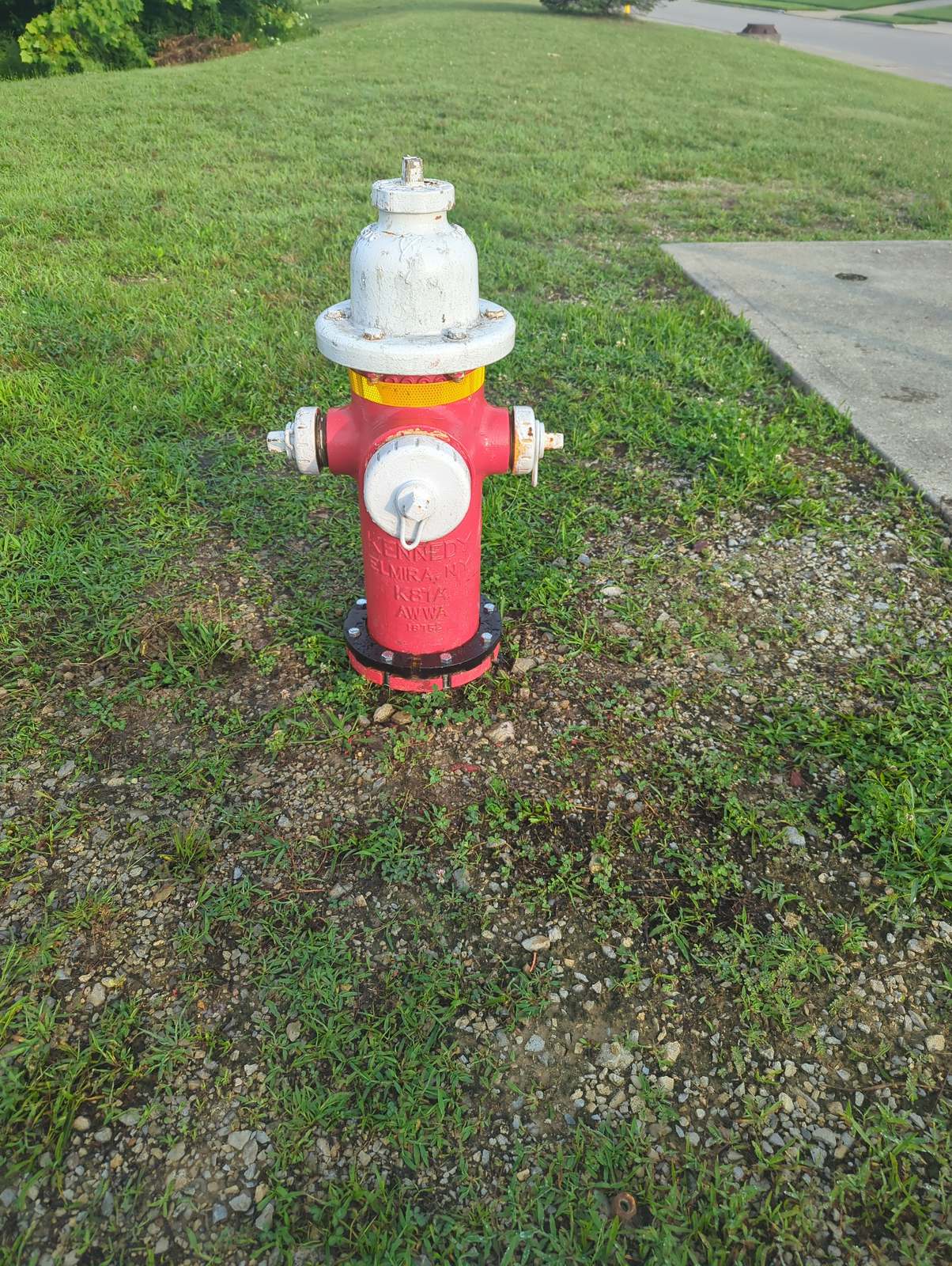 Kennedy private fire hydrant painted red and white