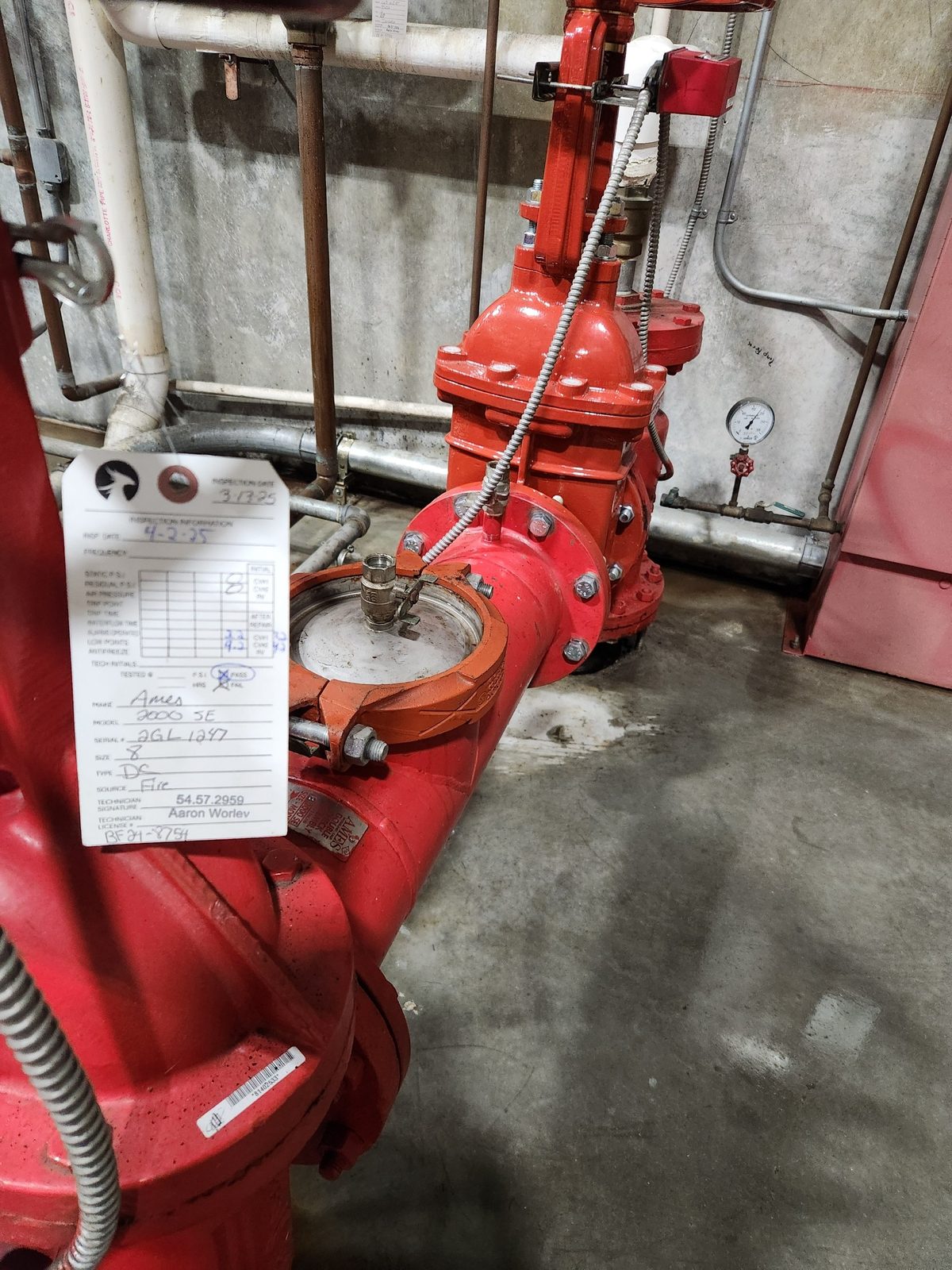 Ames fire-line backflow with a Phoenix inspection tag